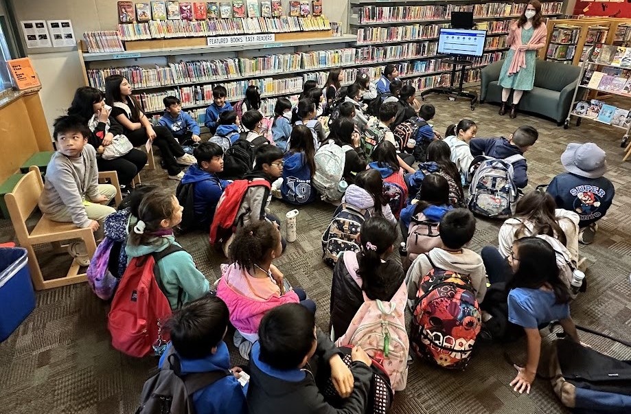 Children watching presentation at the library